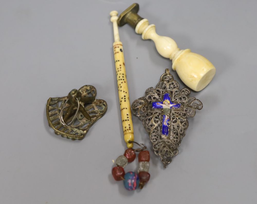 An ivory handle seal and a silver and enamel crucifix, a Victorian bone bobbin personalised Elisabeth, 12cm and a bronze seal